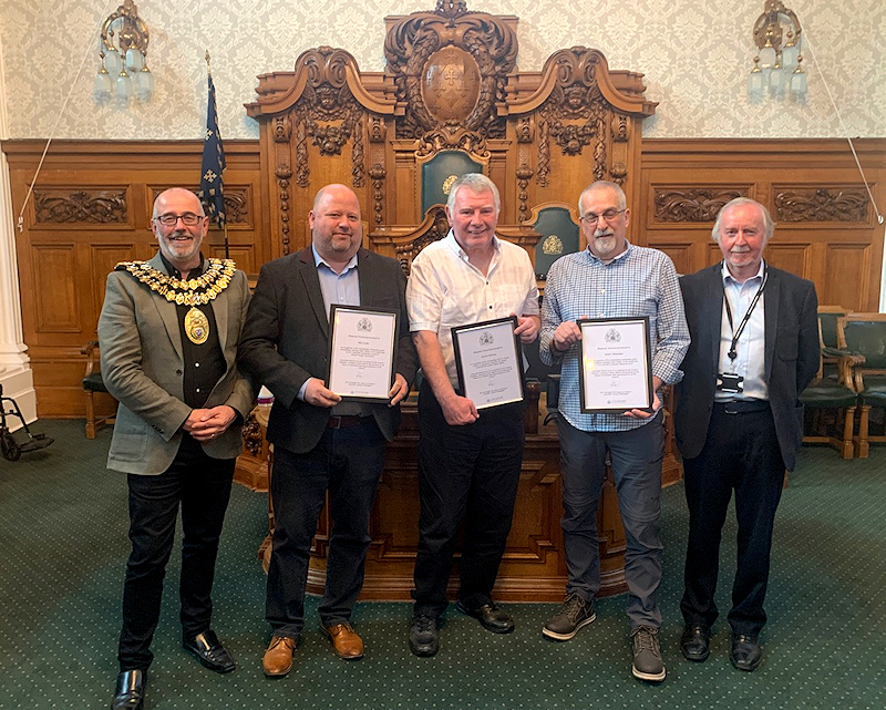 Marple trio receive their awards from the Mayor of Stockport